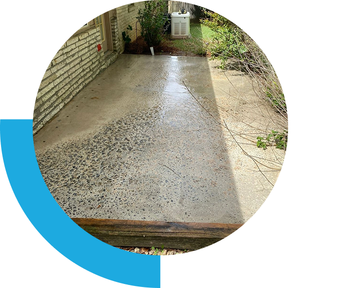 Wet concrete patio with outdoor AC unit