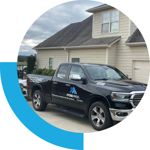 Black Hydro Pros pickup truck in driveway