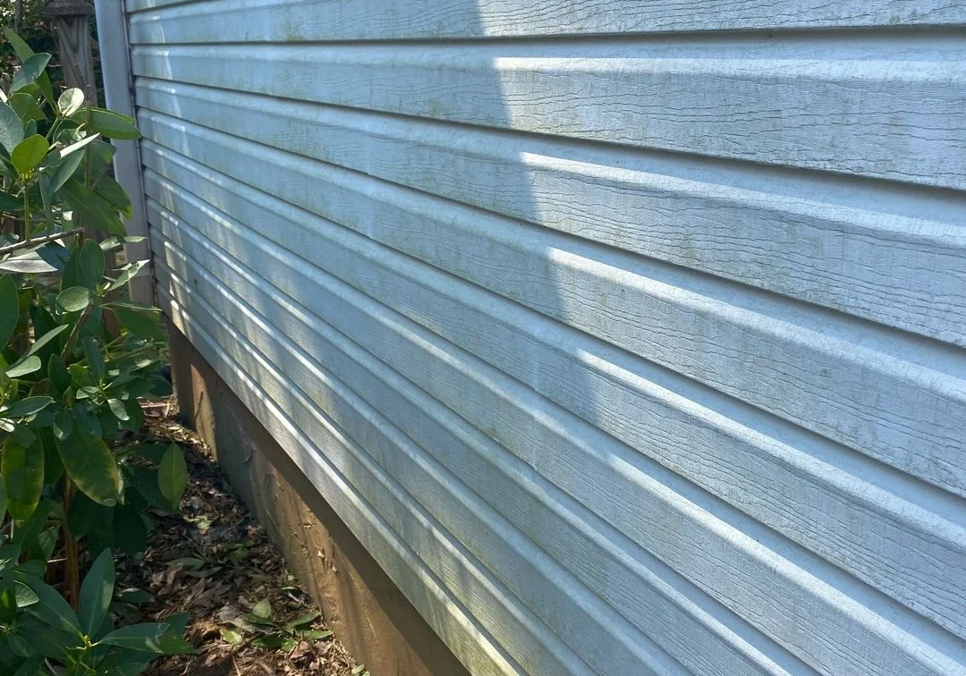 Side of house with blue horizontal siding